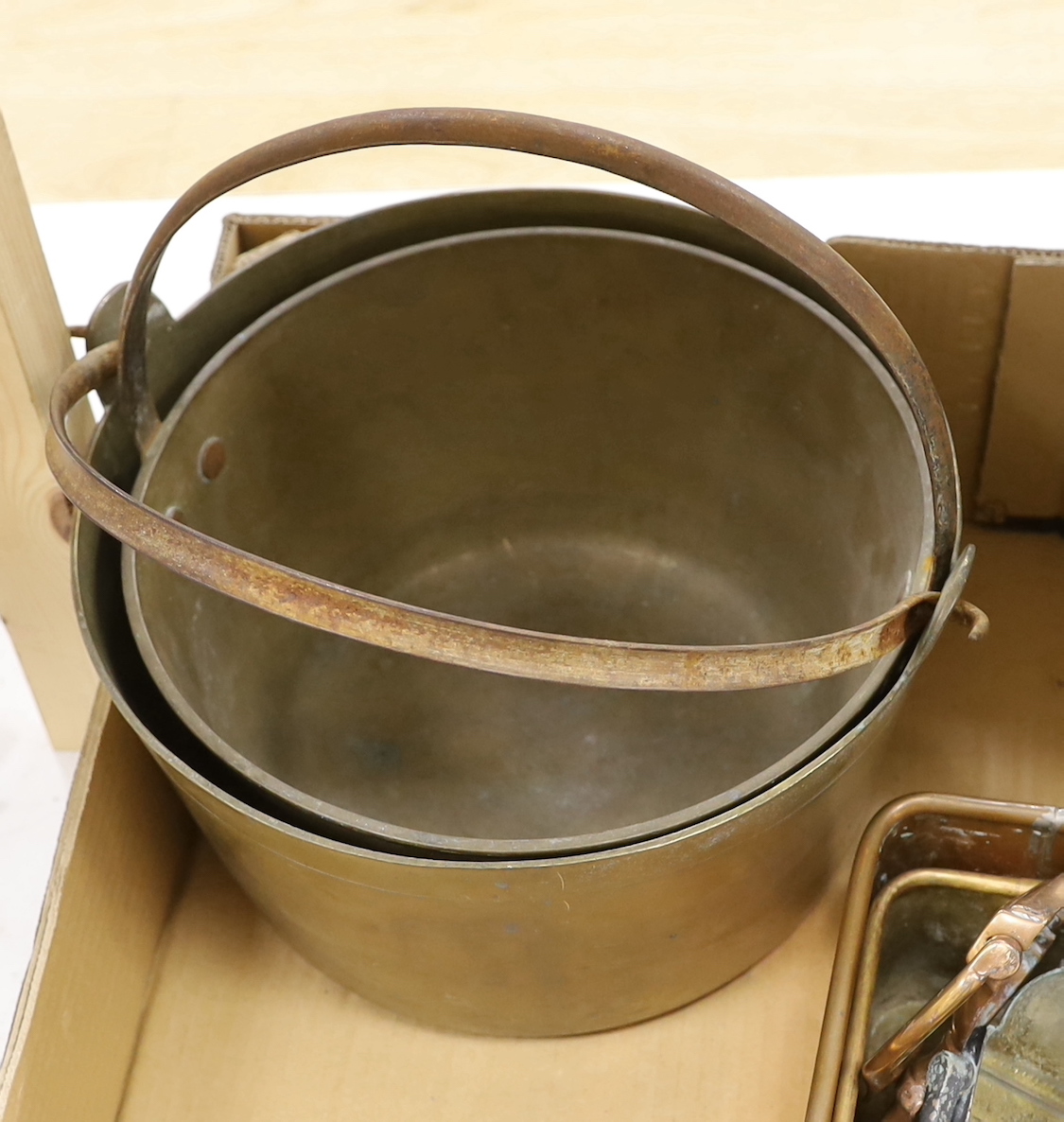 Two brass preserve pans, copper / brass planters, door knockers, etc.